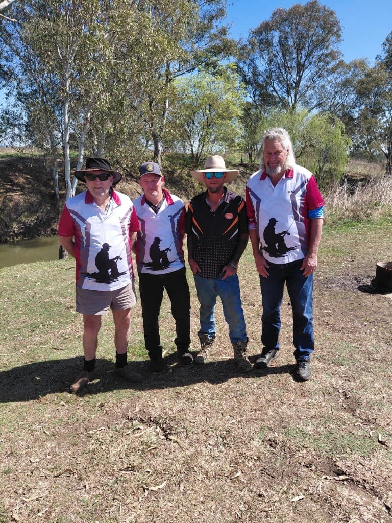 DJ, Will, Matt, and Keno of Driftwood Dreams standing on the bank at Warrego Farm, Junabee